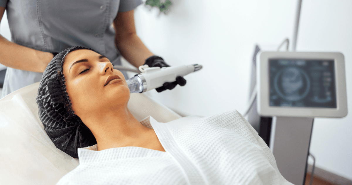 A woman receiving facial aesthetics, a service offered at Contour Room.